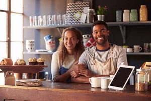 Couple happy about the opening day of their bakery shop